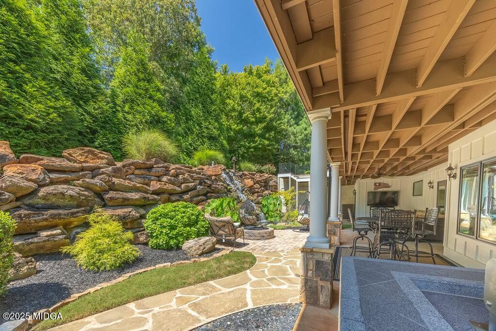 601 River Overlook Forsyth, GA 31029 - Photo 82 of 85 a view of a patio with table and chairs and potted plants