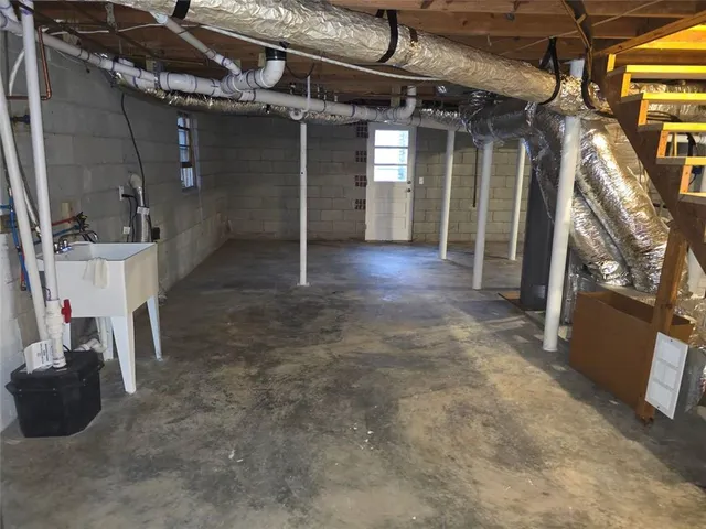 a view of empty room with wooden ceiling