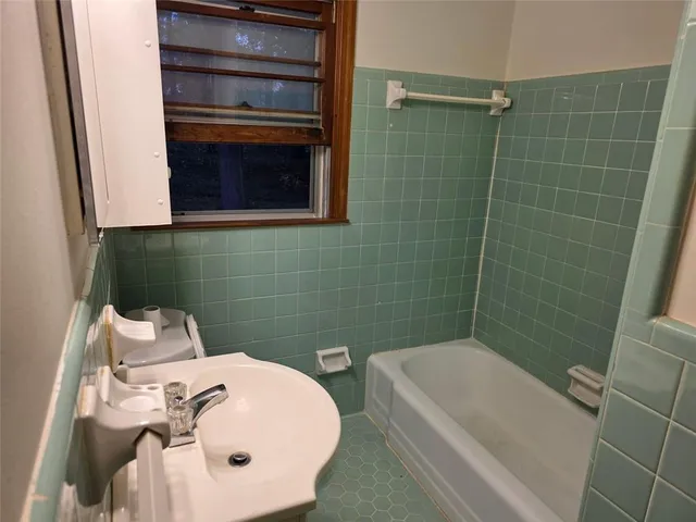a bathroom with a sink and bathtub