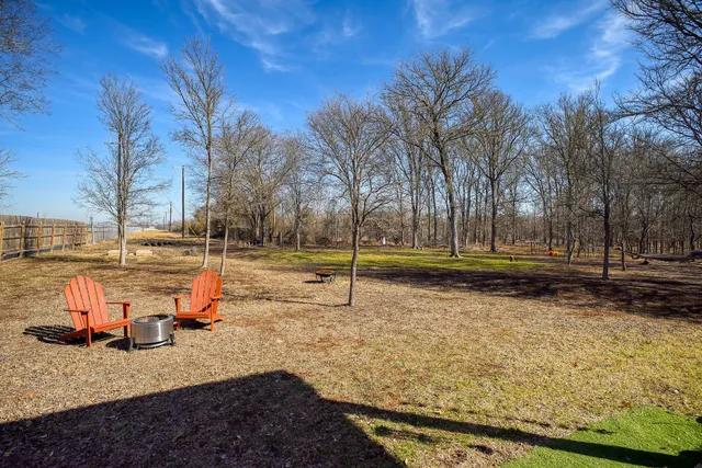 a backyard of a house with lots of green space