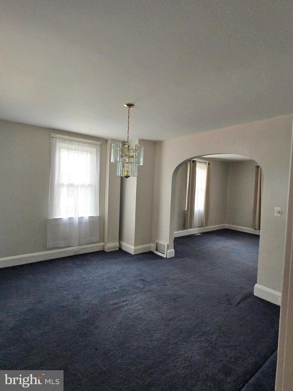 3015 Ritchie Avenue Baltimore, MD 21219 - Photo 5 of 17 an empty room with window and pillar in it