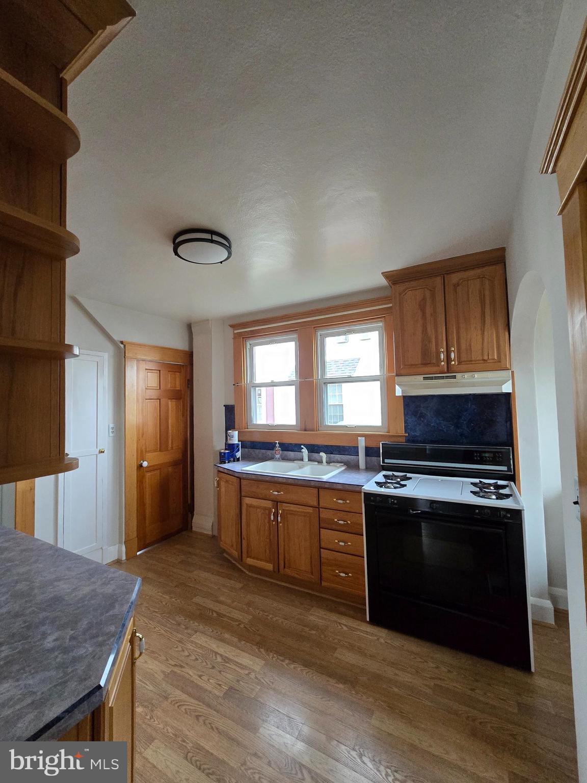 3015 Ritchie Avenue Baltimore, MD 21219 - Photo 7 of 17 a kitchen with stainless steel appliances granite countertop a stove and a sink