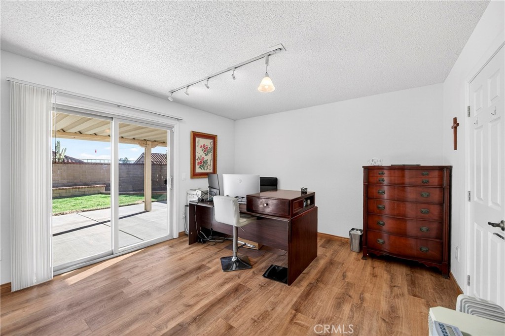 6109 Vineyard Avenue Rancho Cucamonga, CA 91701 - Photo 11 of 22 a view of a workspace with furniture and a window