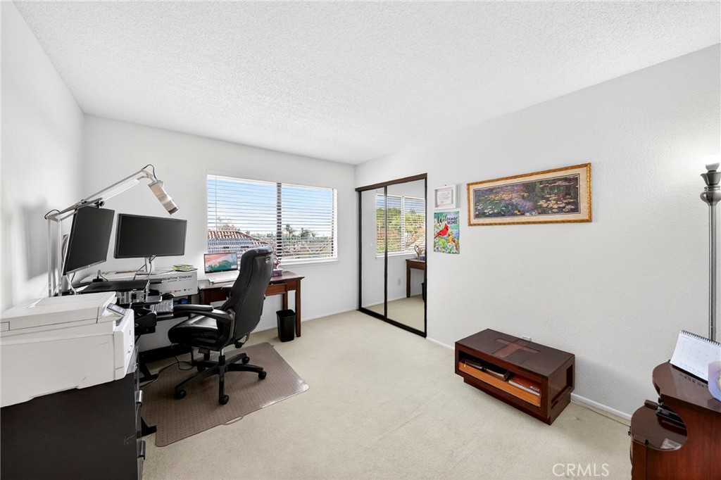 6109 Vineyard Avenue Rancho Cucamonga, CA 91701 - Photo 15 of 22 a view of a workspace with furniture and a window