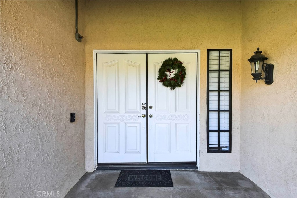 6109 Vineyard Avenue Rancho Cucamonga, CA 91701 - Photo 2 of 22 a view of a door and a glass door