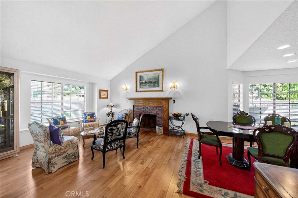 6109 Vineyard Avenue Rancho Cucamonga, CA 91701 - Photo 5 of 22 a living room with fireplace furniture and a large window
