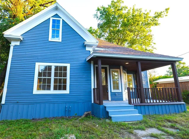front view of a house with a yard