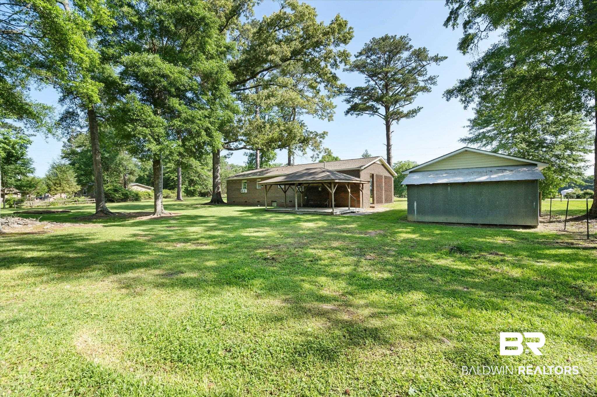 427 Upper Ferry Road Leroy, AL 36548 - Photo 15 of 37 View of grassy yard featuring an outdoor structure and a gazebo