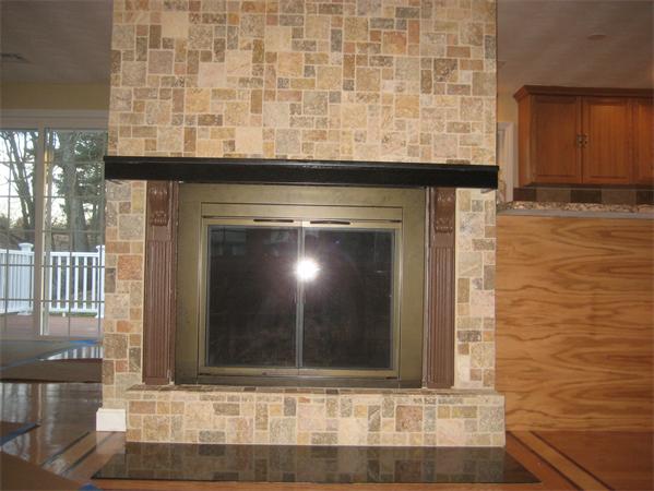 a view of fireplace and wooden floor