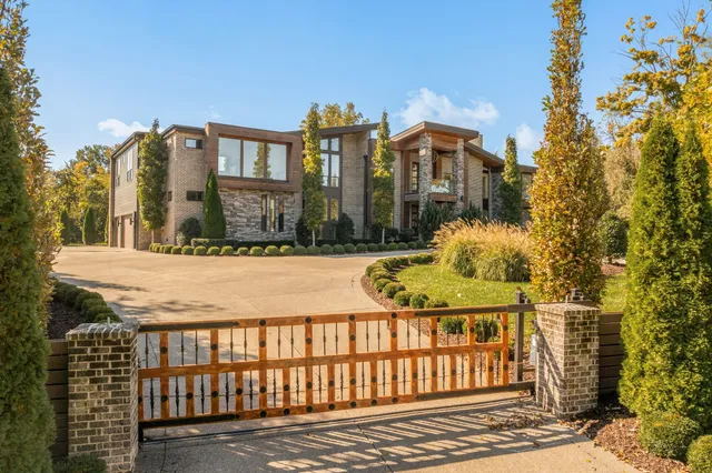 a view of a brick building next to a yard