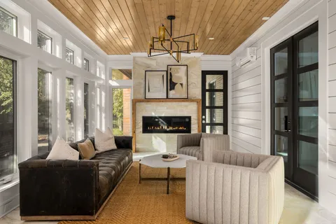 a white bath tub sitting next to a white sink