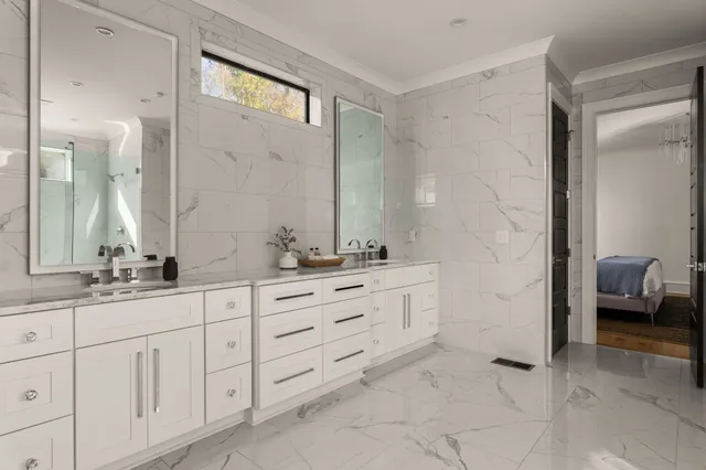 a view of a livingroom with furniture and floor to ceiling window