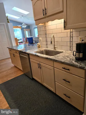 a kitchen with sink and window