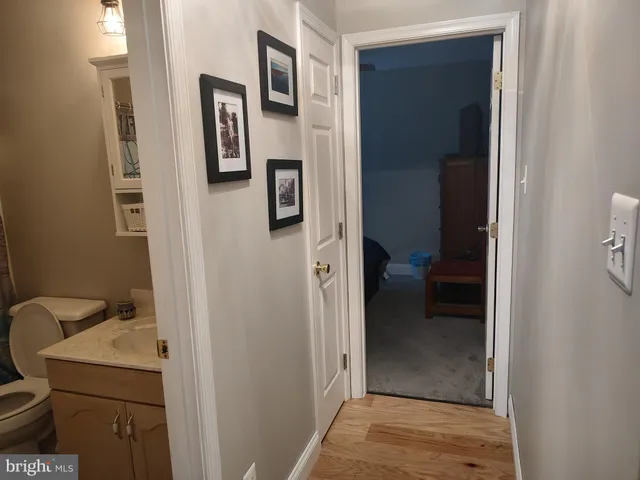 a bedroom with a bed and a mirror