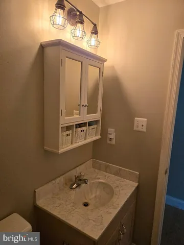 a view of a house with a garden and plants