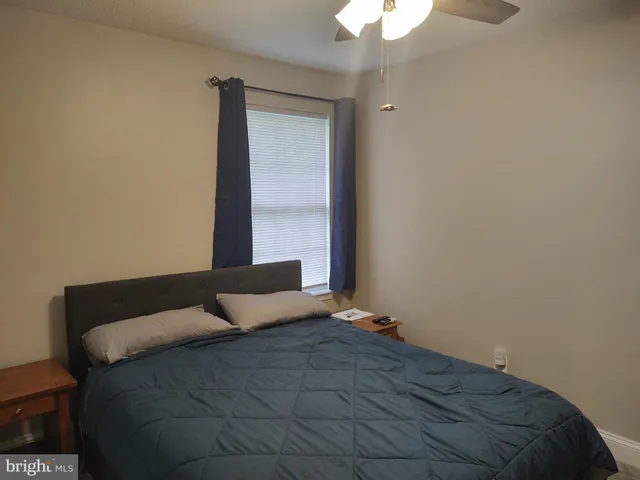 a view of an house with backyard space and balcony