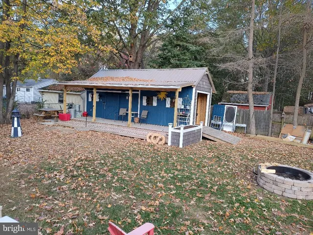 a view of a large building with a big yard and large trees