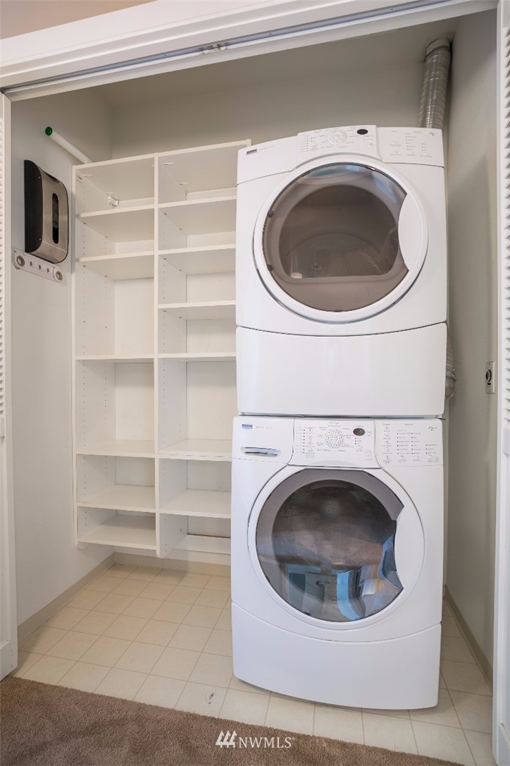 2000 Alaskan Way, Unit 257 Seattle, WA 98121 - Photo 19 of 25 a utility room with washing machine