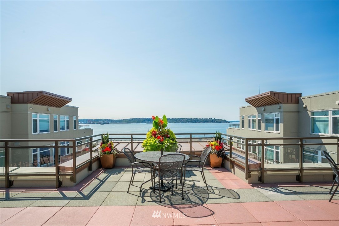 2000 Alaskan Way, Unit 257 Seattle, WA 98121 - Photo 21 of 25 an outdoor living space with furniture and mountain view