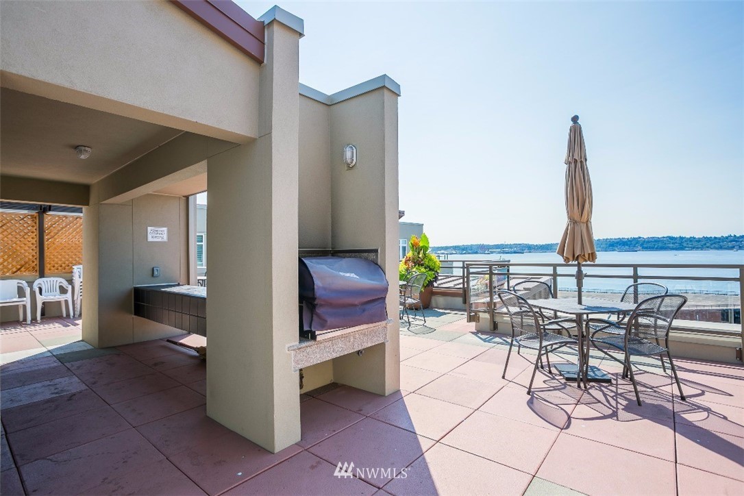 2000 Alaskan Way, Unit 257 Seattle, WA 98121 - Photo 22 of 25 a view of kitchen with furniture and outdoor seating