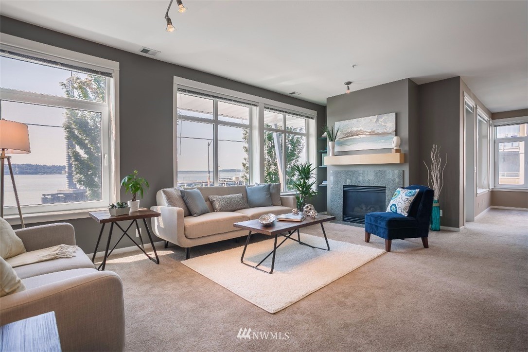 2000 Alaskan Way, Unit 257 Seattle, WA 98121 - Photo 5 of 25 a living room with furniture and a large window