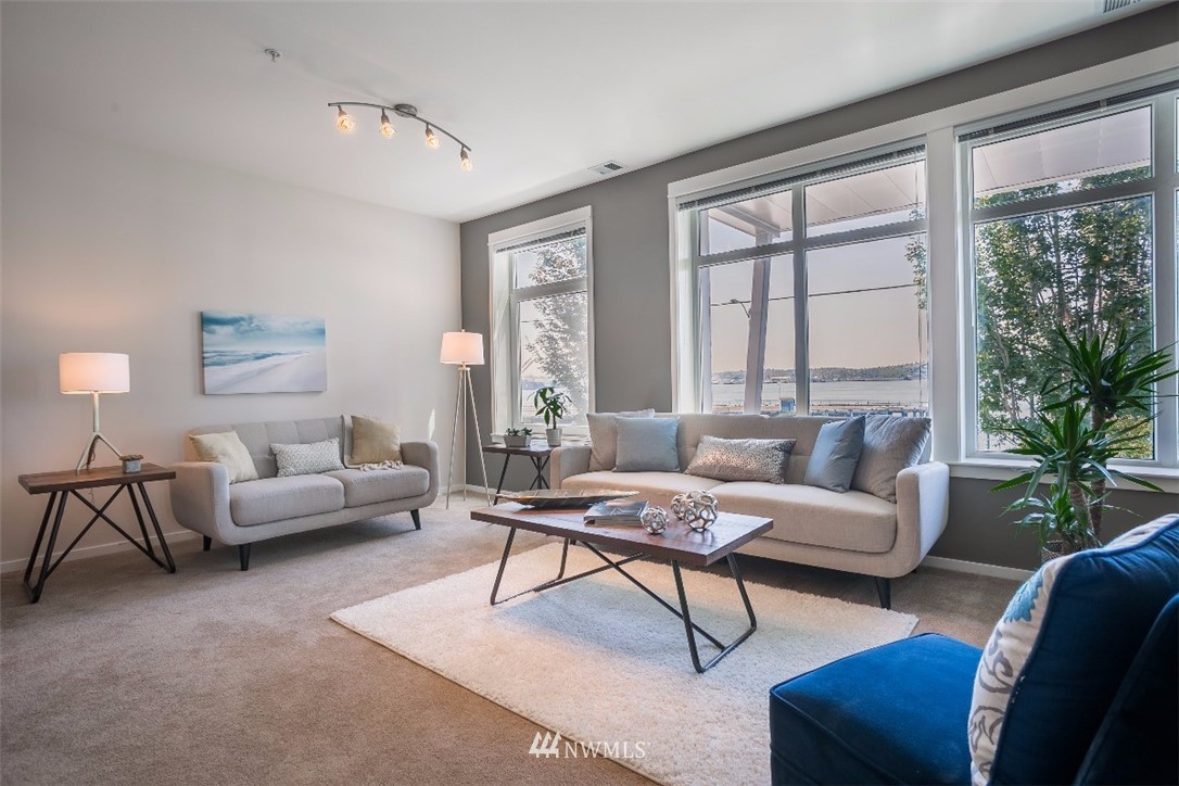 2000 Alaskan Way, Unit 257 Seattle, WA 98121 - Photo 6 of 25 a living room with furniture and a large window