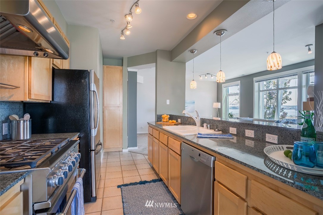 2000 Alaskan Way, Unit 257 Seattle, WA 98121 - Photo 8 of 25 a kitchen with granite countertop lots of counter top space