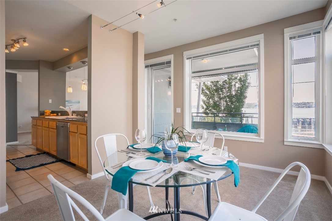 2000 Alaskan Way, Unit 257 Seattle, WA 98121 - Photo 10 of 25 a view of a dining room with furniture window and outside view