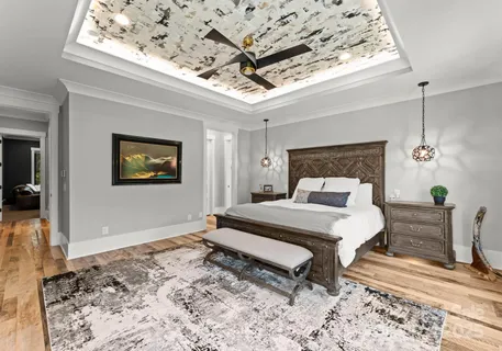 a bedroom with a bed and a dresser