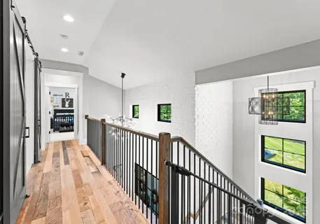 a view of a hallway with windows