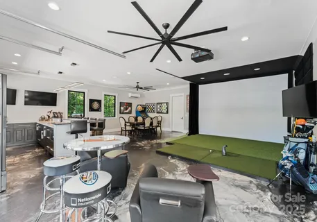 a room with furniture and a flat screen tv