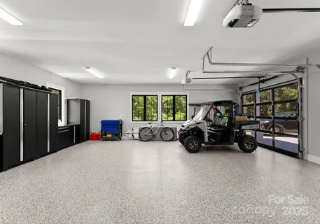a view of a garage with parked cars