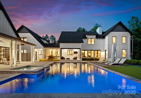 a view of a swimming pool with seating area