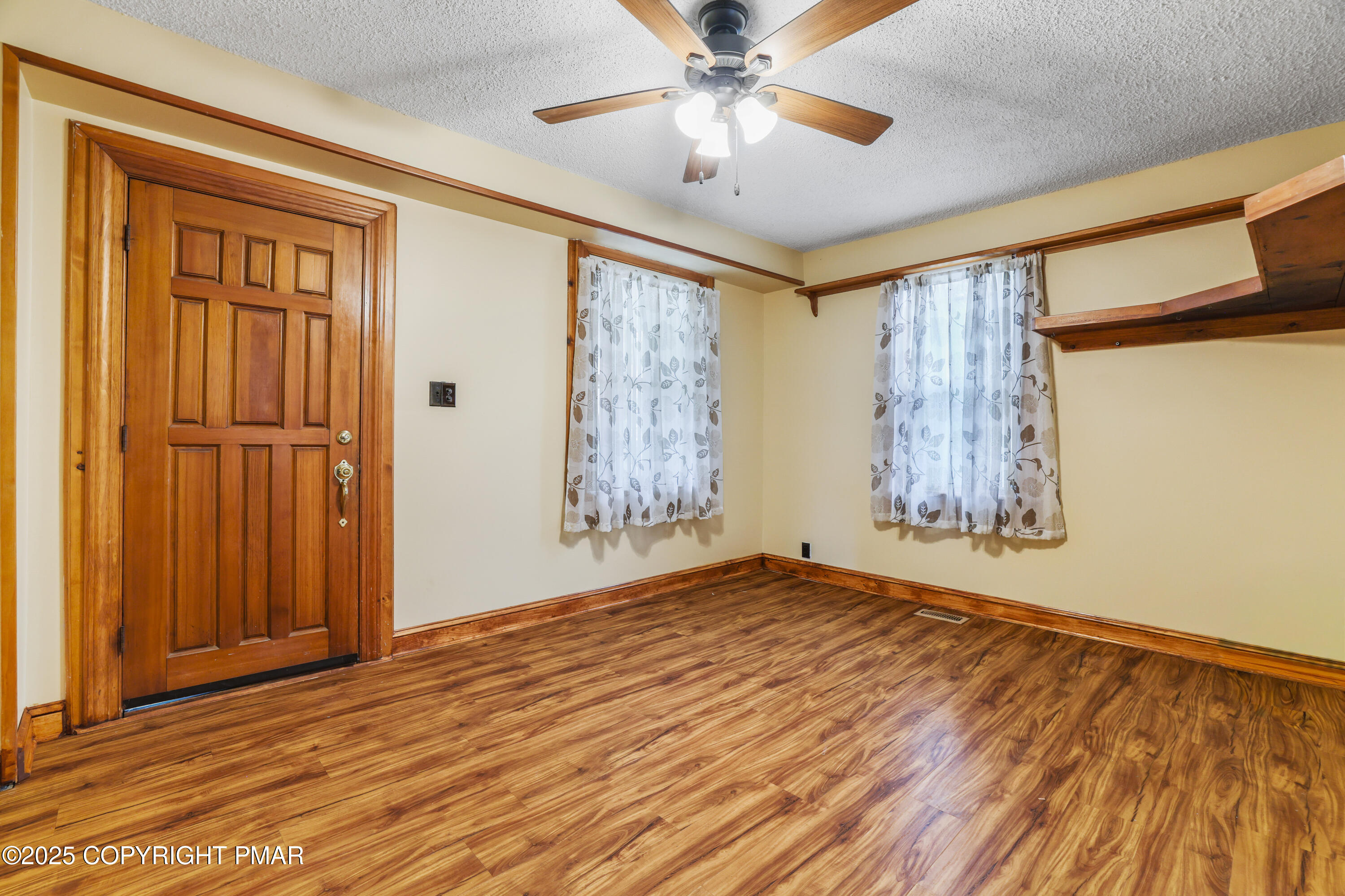 29 Reeder Street Mount Pocono, PA 18344 - Photo 19 of 50 a view of an empty room with window and wooden floor