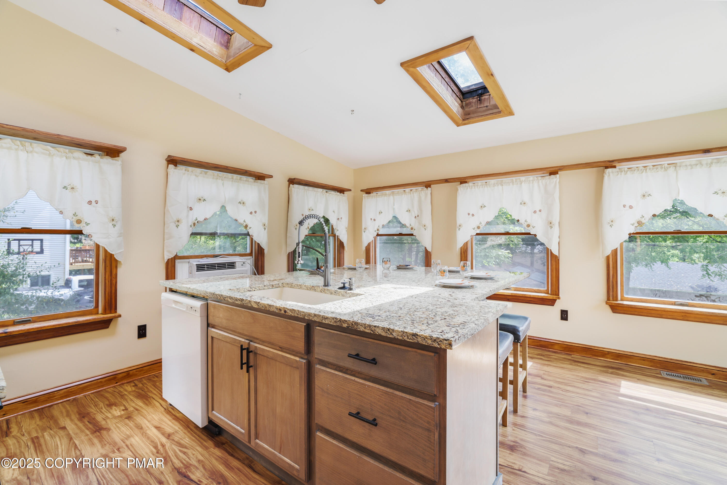 29 Reeder Street Mount Pocono, PA 18344 - Photo 25 of 50 a kitchen with stainless steel appliances granite countertop a stove a sink and a wooden cabinets