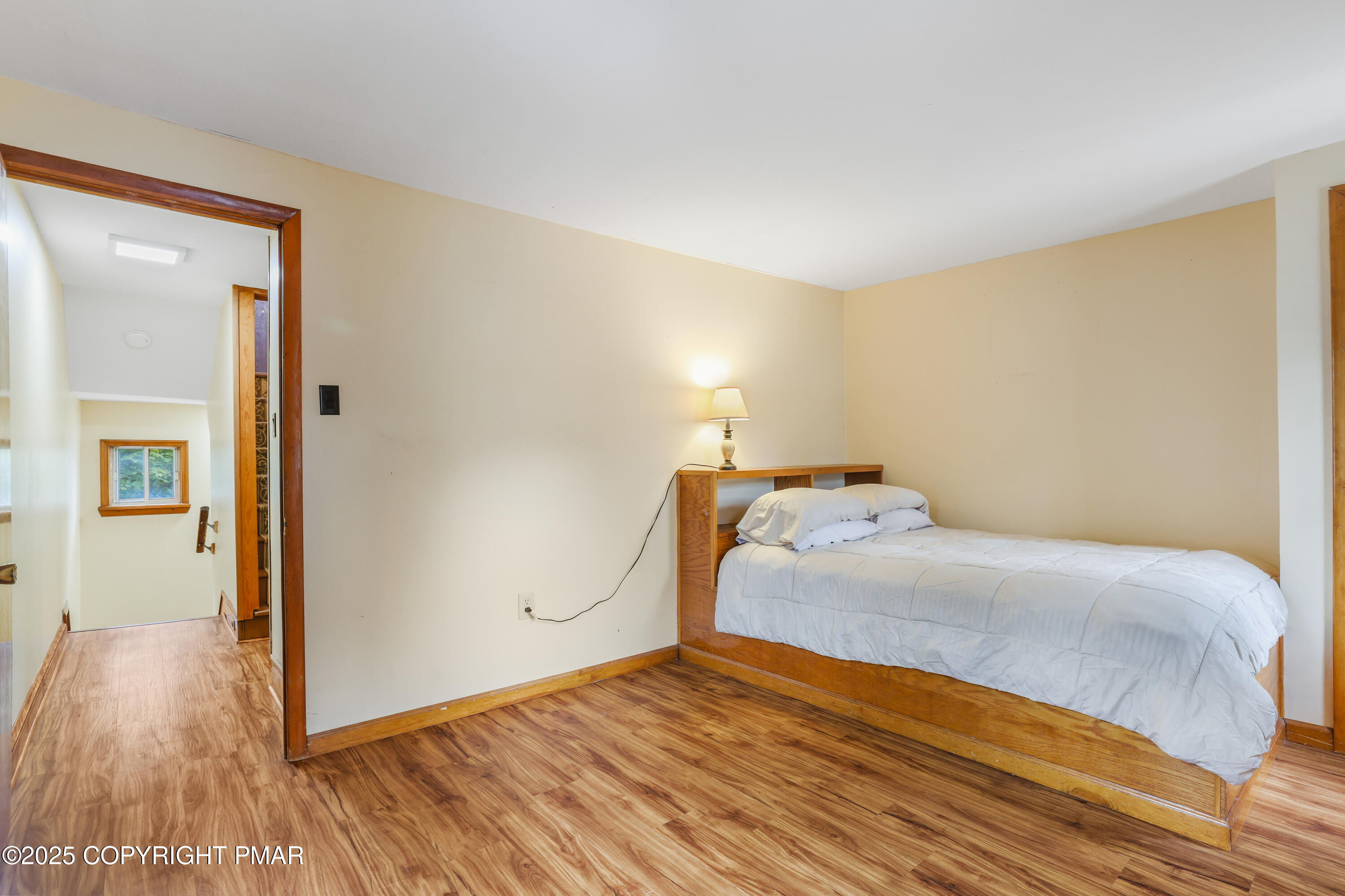 29 Reeder Street Mount Pocono, PA 18344 - Photo 37 of 50 a bedroom with a bed and wooden floor
