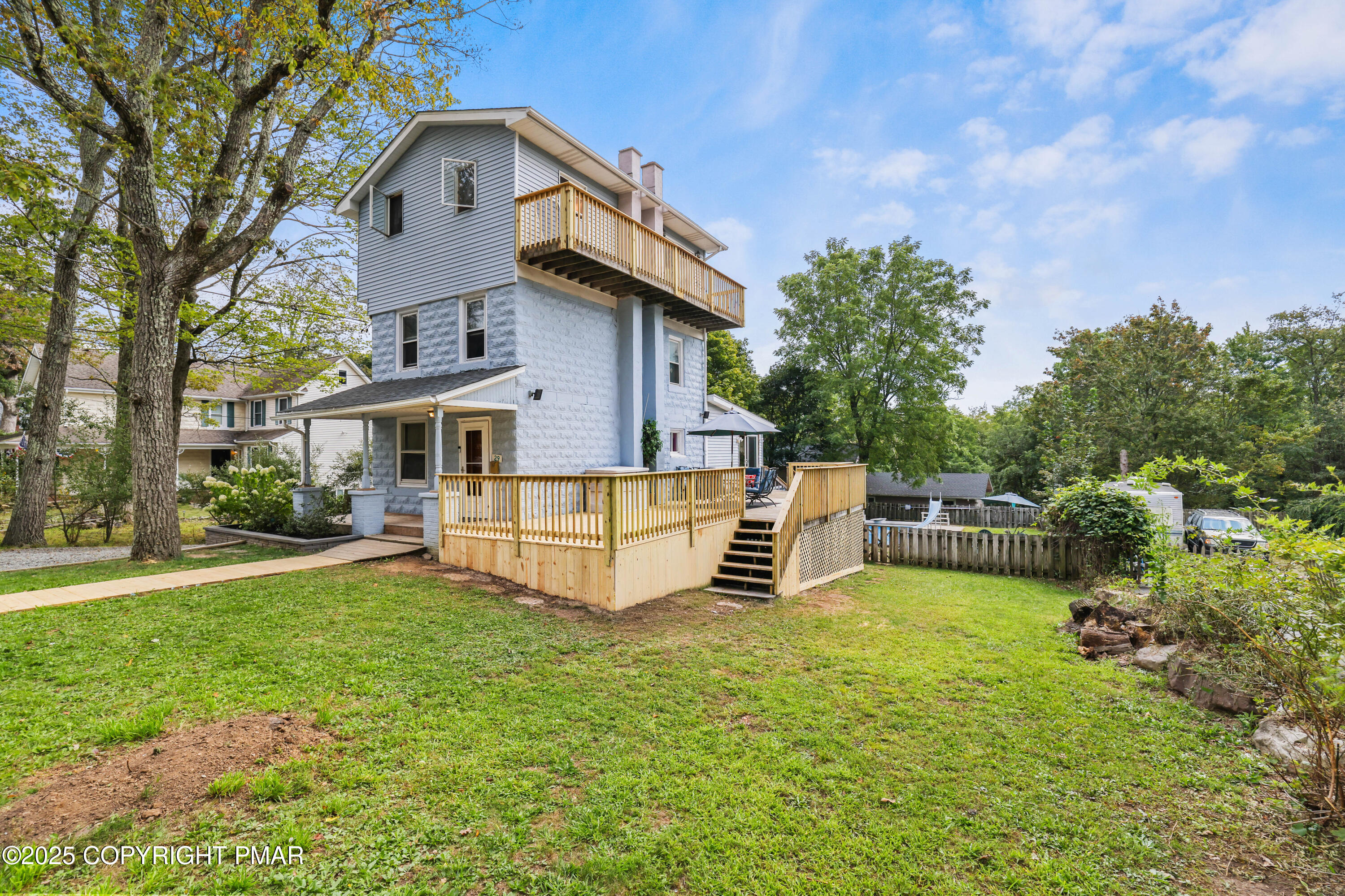 29 Reeder Street Mount Pocono, PA 18344 - Photo 4 of 50 a view of a house with a yard and sitting area