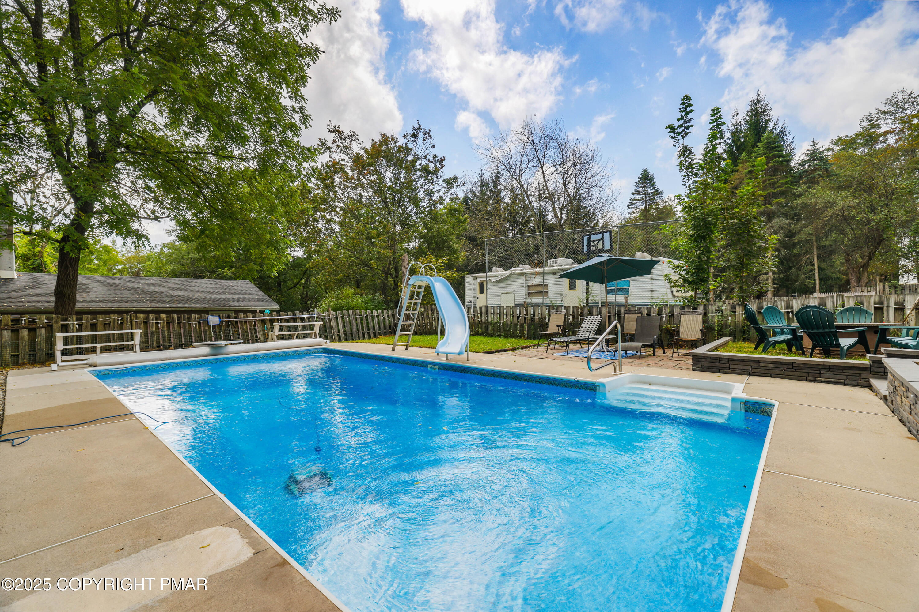 29 Reeder Street Mount Pocono, PA 18344 - Photo 46 of 50 a view of a swimming pool with sitting area and garden