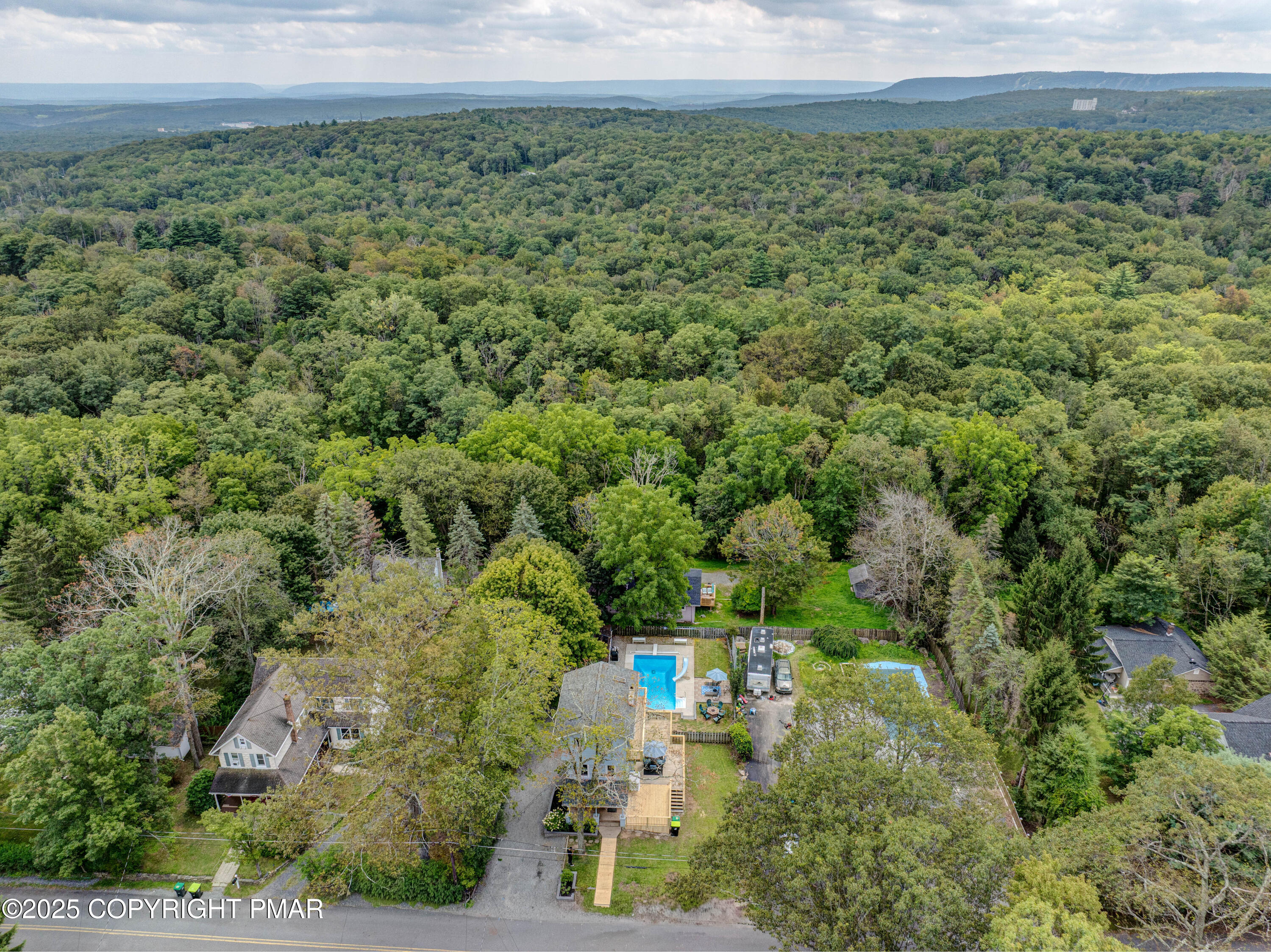 29 Reeder Street Mount Pocono, PA 18344 - Photo 7 of 50 a view of a green field with lots of bushes