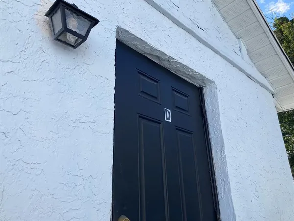 a kitchen with white cabinets sink and white appliances