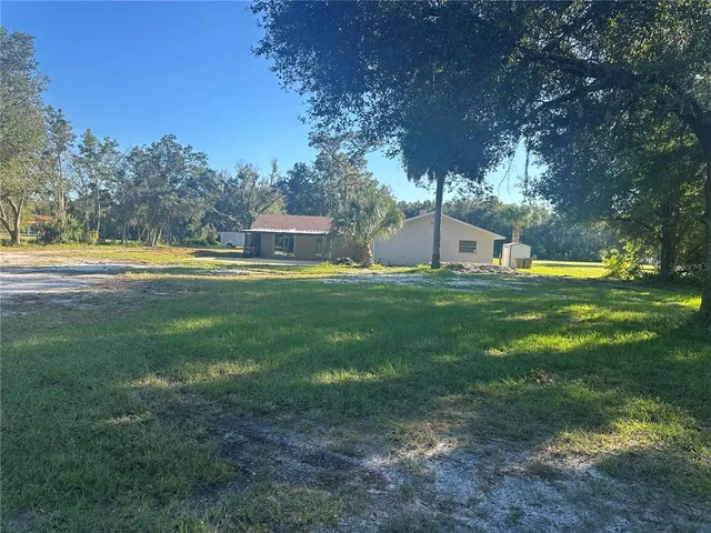 a view of a house with a big yard