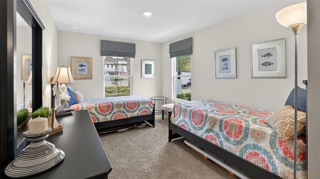 34 Divot Place Bunnell, FL 32110 - Photo 18 of 51 a bedroom with a bed and a couch