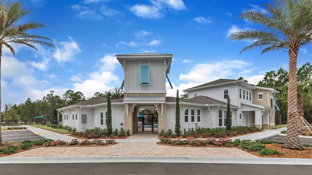 34 Divot Place Bunnell, FL 32110 - Photo 22 of 51 a front view of a house with a garden