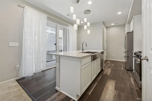 a bathroom with a double vanity sink a mirror and a shower