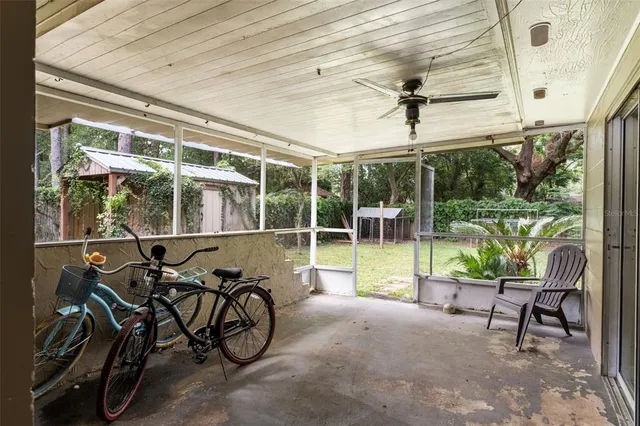 a view of sitting area in balcony with wooden floor
