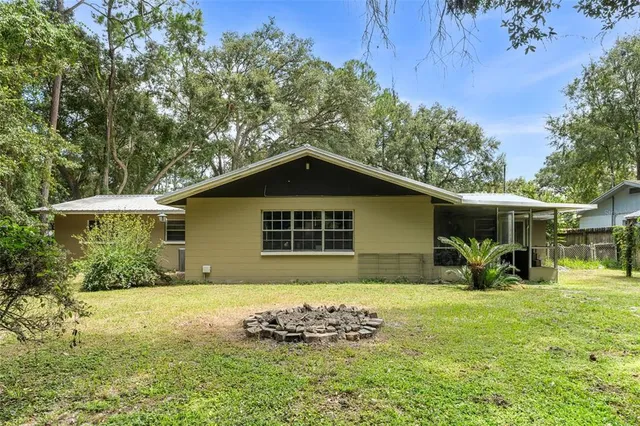 a view of a backyard of the house