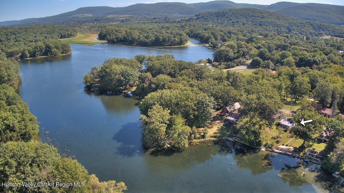 1129 Lakeview Road Copake, NY 12516 - Photo 5 of 12 a view of a lake with mountains in front of it