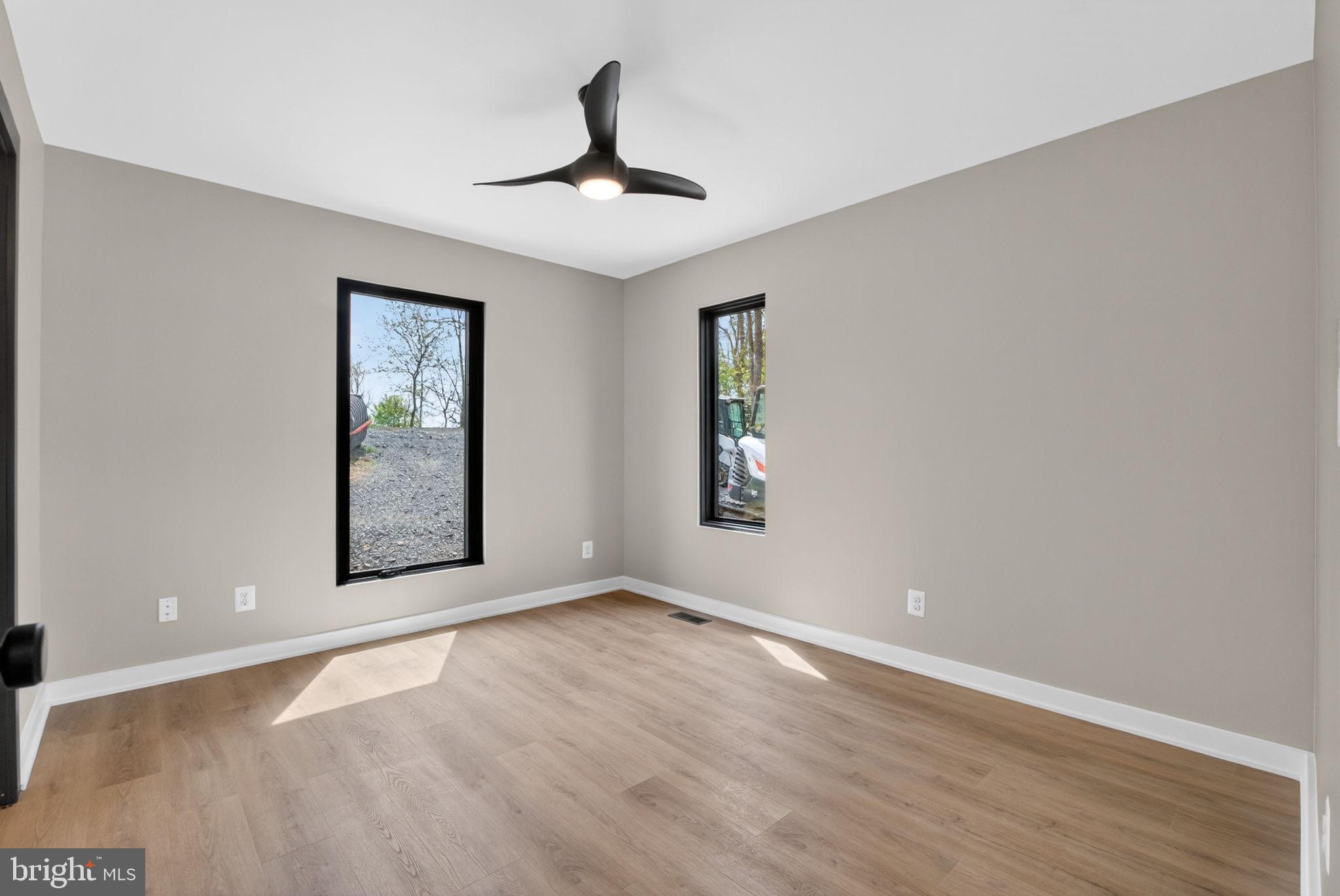 4101 Supinlick Ridge Road Mount Jackson, VA 22842 - Photo 12 of 34 a view of an empty room with window and wooden floor