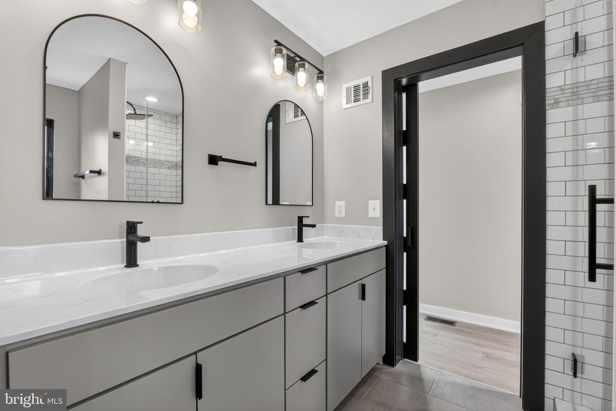 4101 Supinlick Ridge Road Mount Jackson, VA 22842 - Photo 14 of 34 a bathroom with a double vanity sink and a mirror