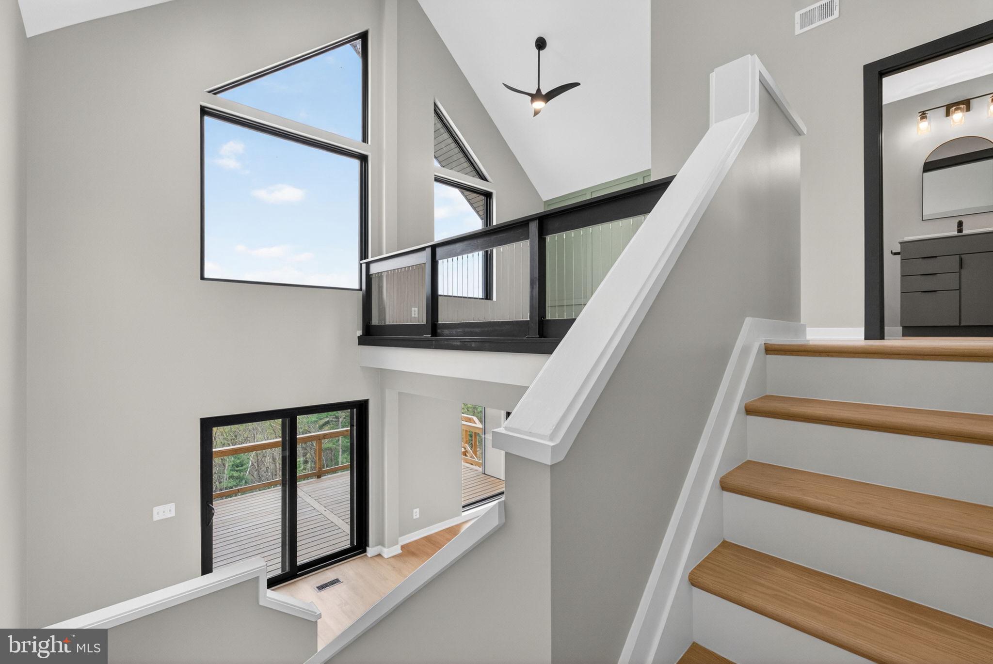 4101 Supinlick Ridge Road Mount Jackson, VA 22842 - Photo 16 of 34 a view of staircase with railing and white walls